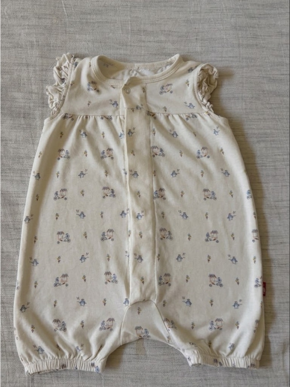 Magnetic Me Cream Romper with Blue and Tan Floral Penguin Accents